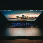 an open laptop computer sitting on top of a table