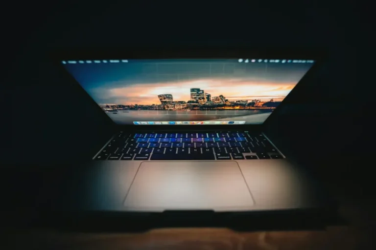 an open laptop computer sitting on top of a table