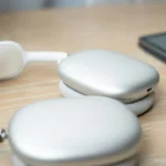 a pair of headphones sitting on top of a wooden table